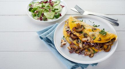 Tasty omelette and salad served on table for lunch