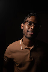Obraz premium Young black ethnicity with chocolate shirt