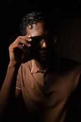 Young black ethnicity with chocolate shirt