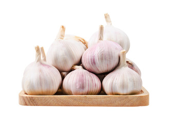 Garlic, sliced garlic clove on vintage wooden dish isolated on white background.