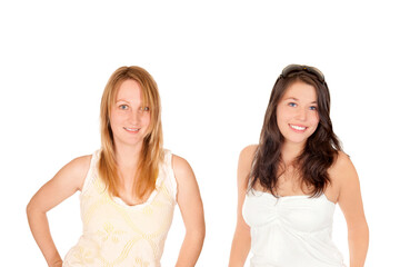 Closeup portraits of two happy young women wearing summer tops, isolated in front of white studio background