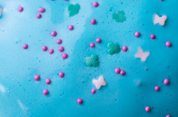 Blue icing sprinkled with confetti on Easter cakes. Easter celebration.