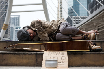 beggar or Homeless man sleep and get cold at winter