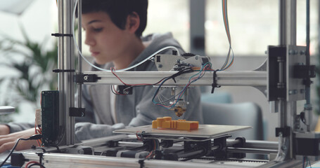 Boy learning 3D printing at home