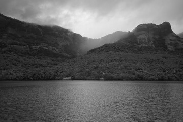 Monochromatic beautiful mountains ranges and water composition during monsoon season in a vacation trek at Maharashtra