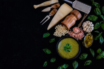 Pesto sauce preparation on the wooden table