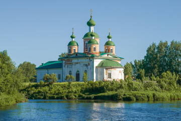 Fototapeta na wymiar View of the ancient cathedral of the Smolensk Icon of the Mother of God on a sunny June day. Olonets, Karelia
