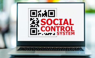 Laptop computer displaying the sign of Social Control System