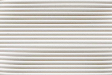 Obraz premium A row of biodegradable eco friendly white paper drinking straw as a background.