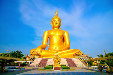 Morning sunshine at Big buddha in Wat Muang  at Ang Thong Province popular Buddhist shrine in...