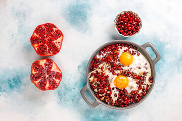 Obraz na płótnie Canvas Traditional Azerbaijan cuisine pomegranate seeds with egg narnumru or nar numru.