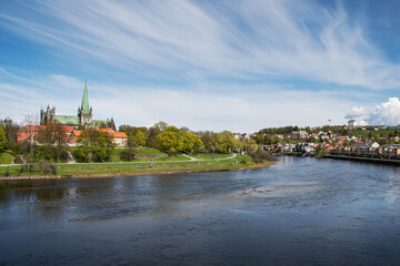 Fototapeta premium View of Nidarosdomen and Christiansten fortress, Trondheim, Norway.. The river Nidelva flows between them. The photo is shot from the bridge, Elgseter.