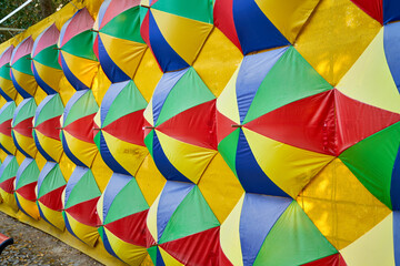 Fototapeta premium colored umbrellas hang on the wall