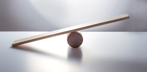 Balance concept, board on wooden top hat like balance isolated on the white background. - obrazy, fototapety, plakaty