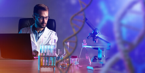 A geneticist in the laboratory. A man is engaged in manipulating genes. Chemist working with sample...