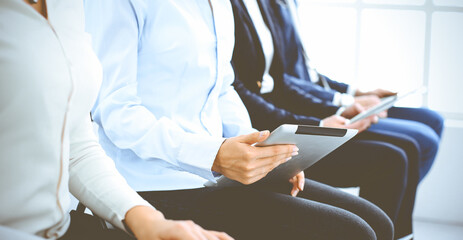 Group of business people working in office, close-up. Businesswoman working with laptop. Conference or training concepts