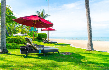 beach chair and umbrella with sea beach background