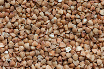 buckwheat granules scattering on a plane top view