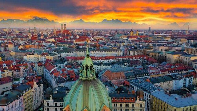 Munich skyline aerial hyperlapse at sunset colored sky view of church st lukas old town town hall marienplatz.