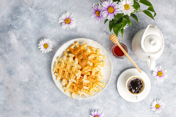 Fototapeta na wymiar Homemade belgian waffles with honey.