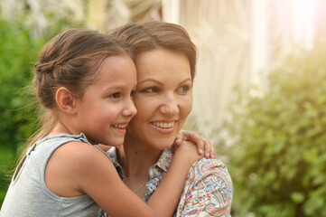 Portrait of  happy mother and daughter outdoors