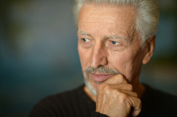 Portrait of sad thinking senior man