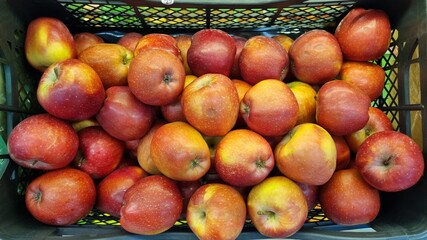 apples in a box. selling fruit and vegetables in the supermarket. 