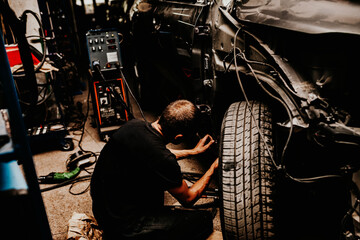 Fototapeta na wymiar Car repair services of any complexity. car repair after an accident. Auto repair shop
