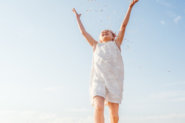 Portrait of happy smiling girl. Sky background.
