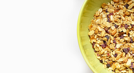 Close up of granola with cranberries and no sugar in a plate. Healthy lifestyle and breakfast concept.The best way to start a day. Vegan and Vegetarian