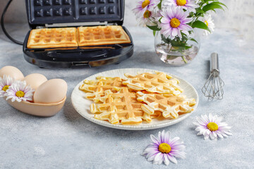 The process of making belgian waffles.