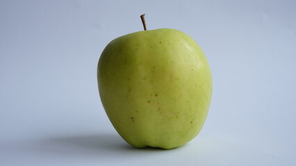 Green apple on a light background.