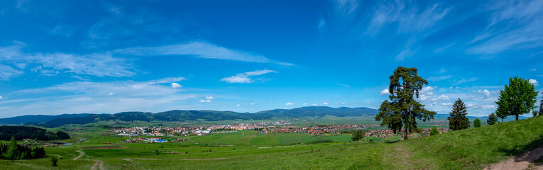Fototapeta na wymiar Panoramic view of the city of Csikszereda in hungarian, Miercurea Ciuc in romanian, at springtime.