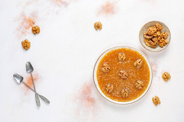 Traditional Azerbaijan,Indian,Turkish sweet dessert halva with walnuts on top.