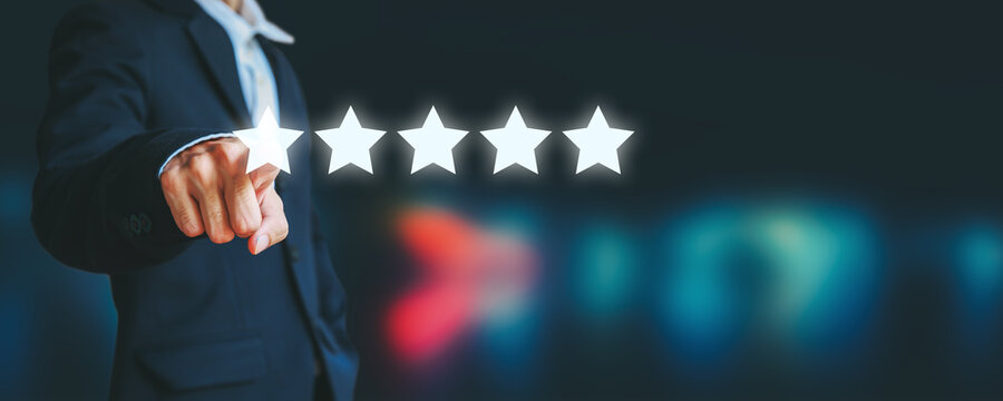 Business man pointing five star icon to give rate of customer service