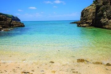 Fototapeta premium Beautiful summer scenery. calm waves on the blue water. Yuhina Beach in Zamami island, Okinawa, Japan - 日本 沖縄 座間味島 ユヒナ 海岸 