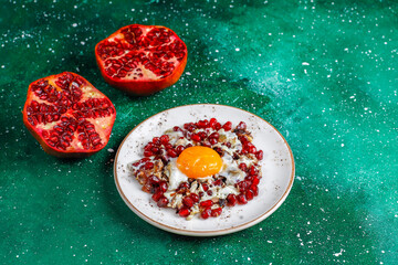 Traditional Azerbaijan cuisine pomegranate seeds with egg narnumru or nar numru.