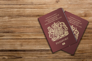 British passport on a wooden background, for a British citizen
