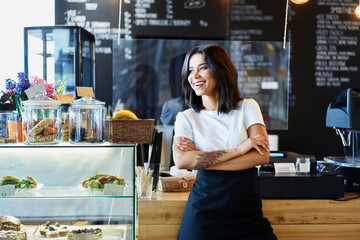 Happy female cafe owner standing. Small business concept.