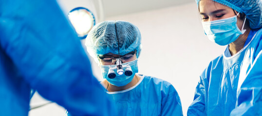 Professional anesthesiologist doctor medical team and assistant preparing patient to gynecological...