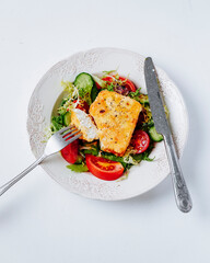 Fried feta cheese with tomato salad