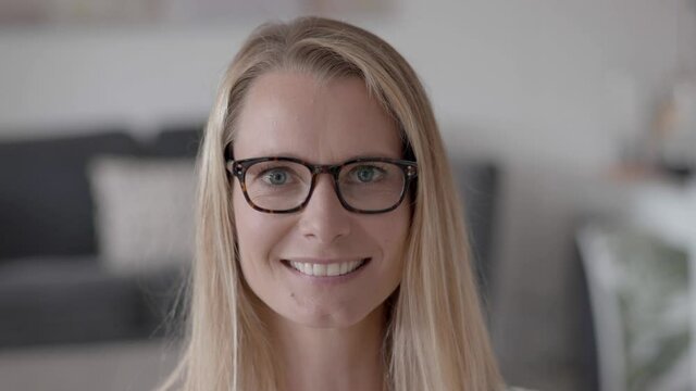 Portrait of attractive blond woman with eyeglasses 