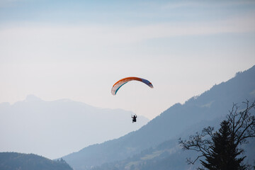 paraglider in the sky, alps