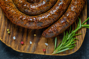 Grilled or Roasted spiral pork sausages with rosemary, salt and peper