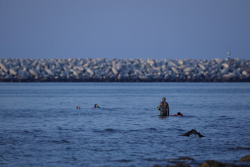Snorkeling in the sea with Kids walking through the sea