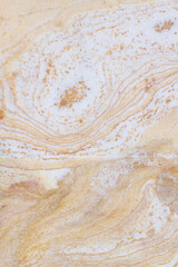 Natural stone background texture with orange, beige and gray tones