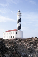lighthouse on the edge of a cliff protecting the ships of the Mediterranean