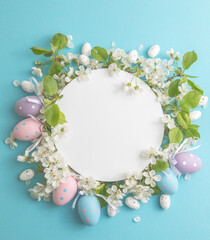 Easter  floral, eggs, composition with paper round blank in the centre of blue background. Branding mock up, holiday marketing concept.