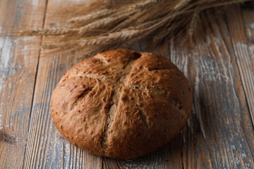 Close up of textured sourdough organic bread with spikes aside, country-style photo for commercial