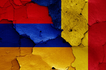 flags of Armenia and Romania painted on cracked wall